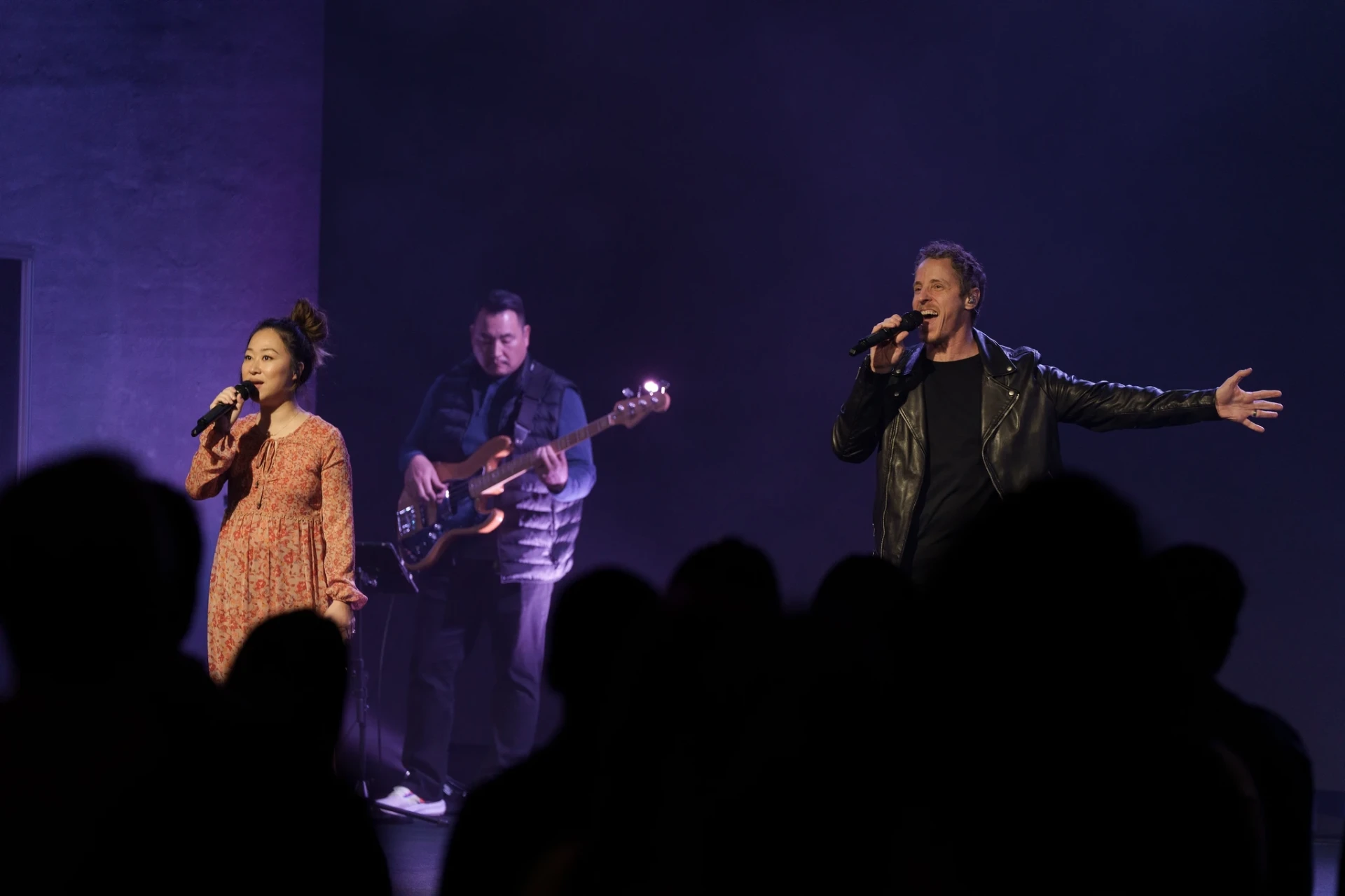 Nathan Armstrong leading worship with the band